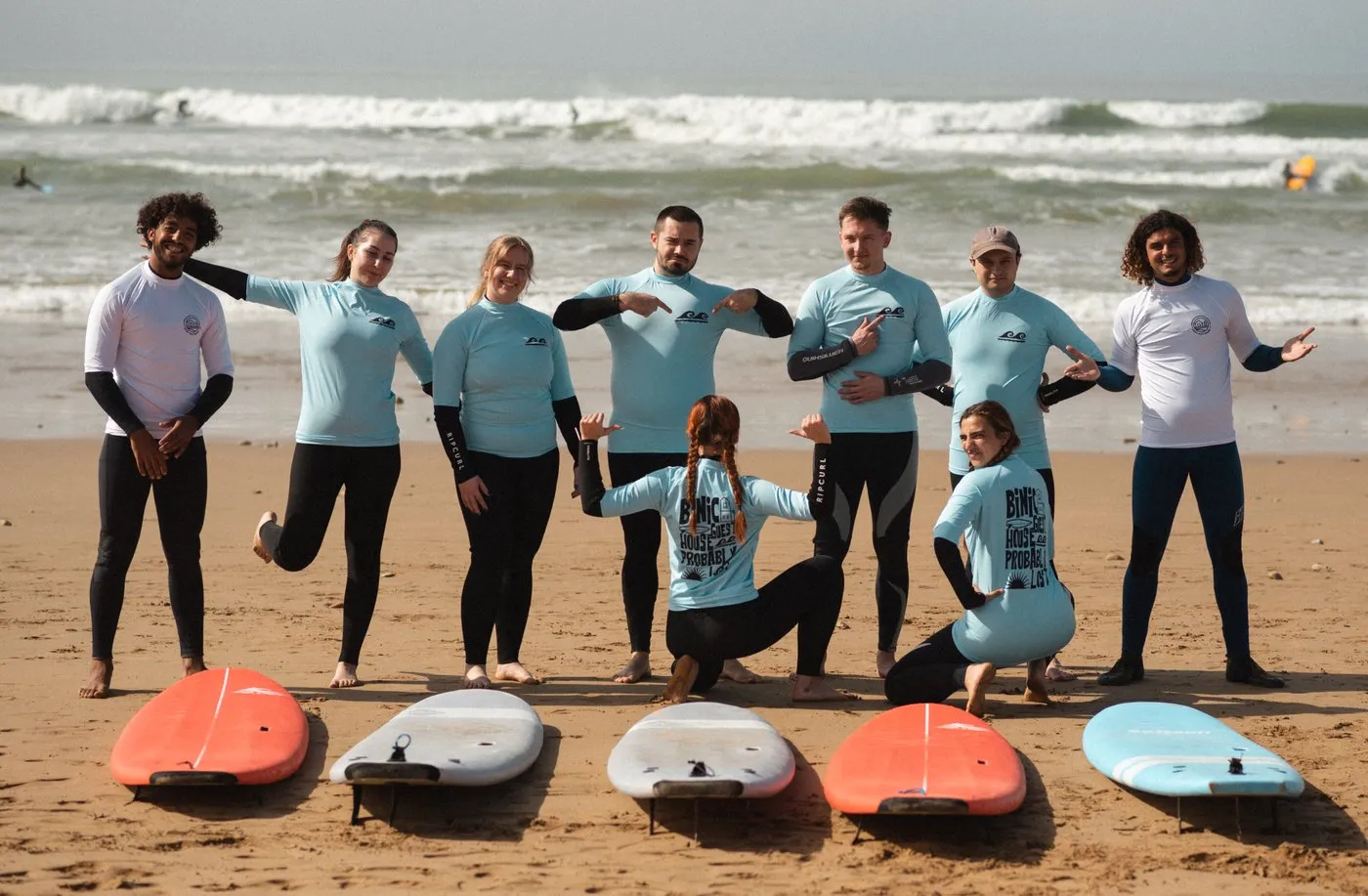 Surf instructor teaching students on Taghazout beach