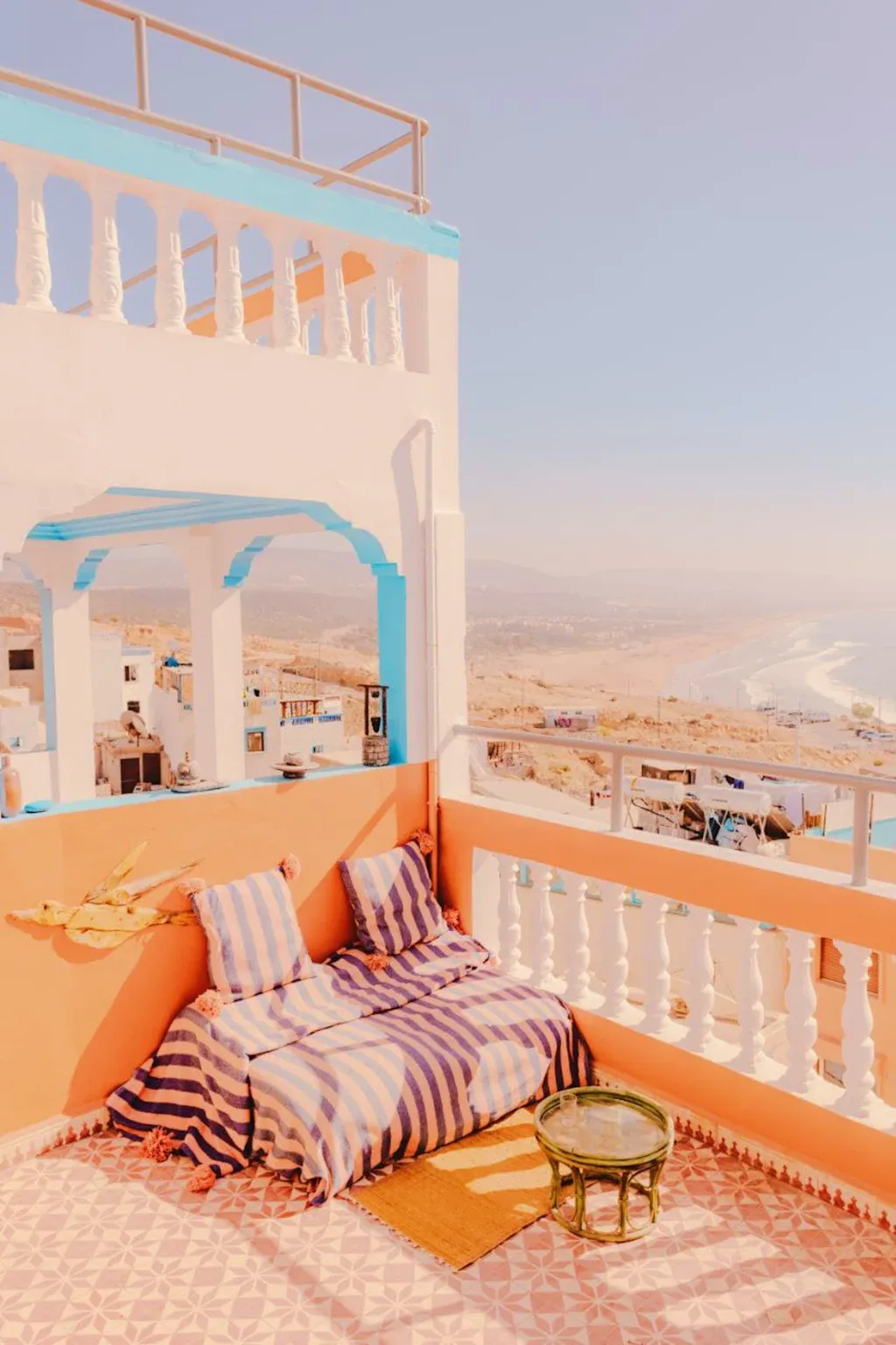 Rooftop terrace with cushions and ocean view